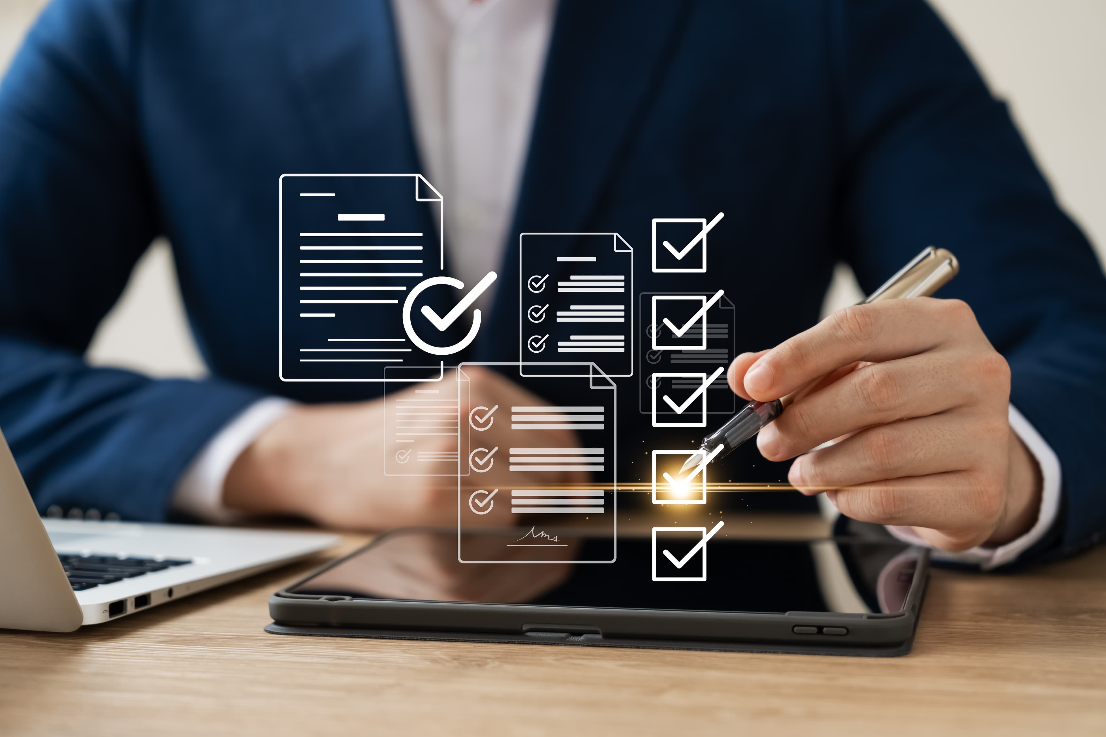 Businessman signing documents on a tablet